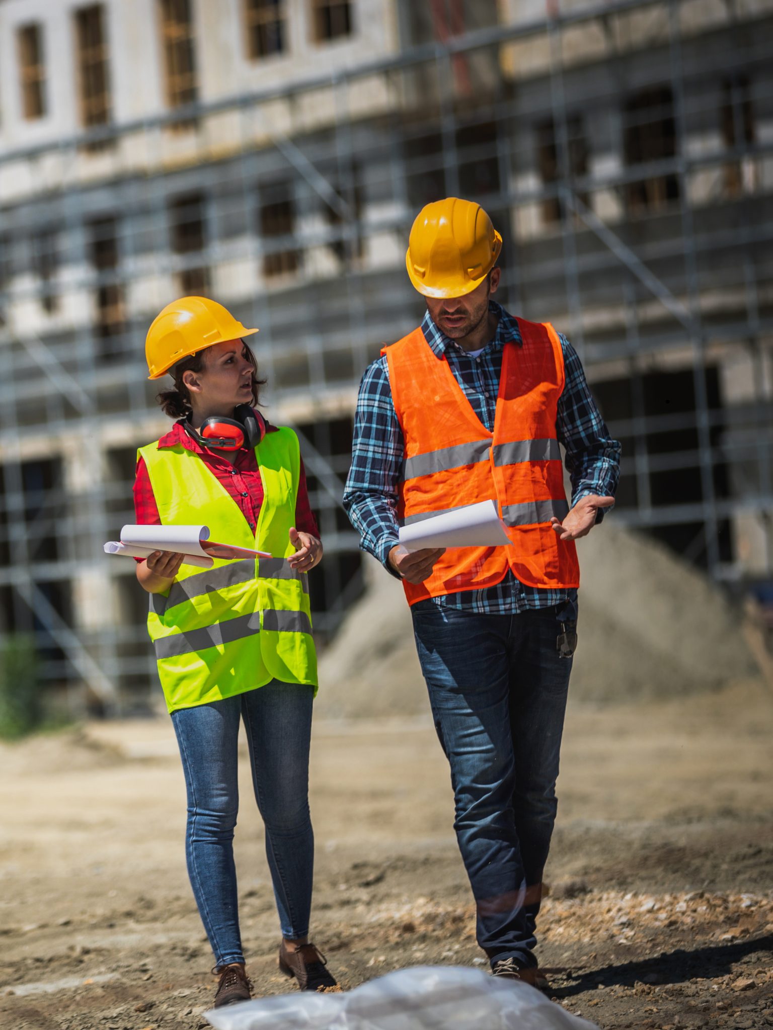 Site managers reviewing drawings on a construction site