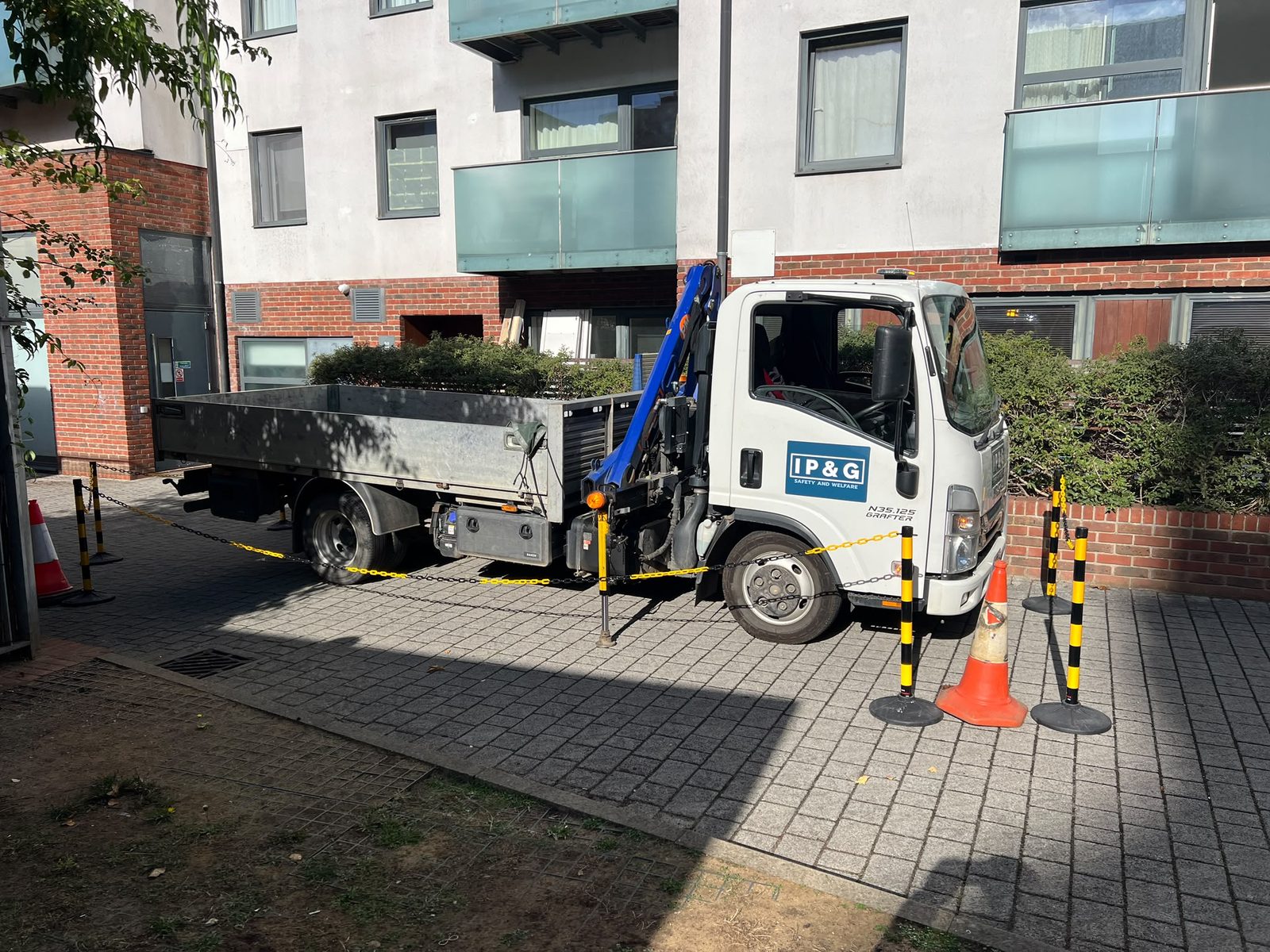 IP&G crane lorry on site with pedestrian barriers in place