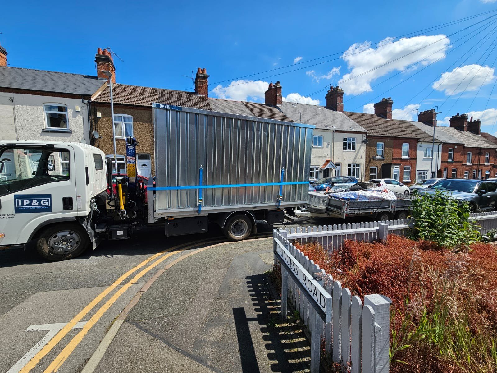 IP&G delivering a container to a residential street